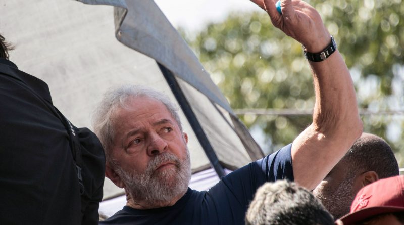 Brazilian ex-president (2003-2011) Luiz Inacio Lula da Silva waves to supporters after attending a Catholic Mass in memory of his late wife Marisa Leticia, at the metalworkers' union building in Sao Bernardo do Campo, in metropolitan Sao Paulo, Brazil, on April 7, 2018.
Brazil's election frontrunner and controversial leftist icon said Saturday that he will comply with an arrest warrant to start a 12-year sentence for corruption. "I will comply with their warrant," he told a crowd of supporters. / AFP PHOTO / NELSON ALMEIDA