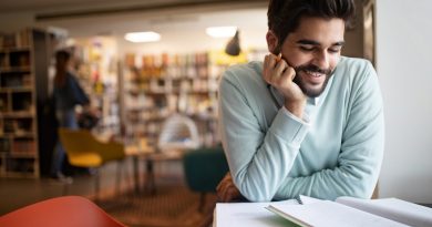 Student preparing exam and learning lessons in college library