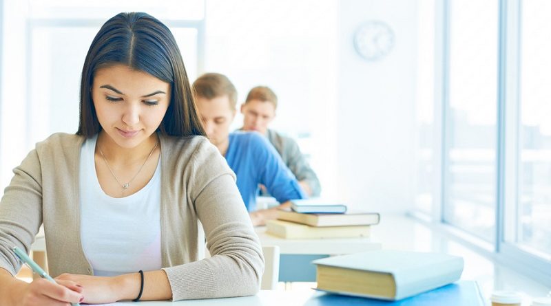 Portrait of pensive student carrying out test at lesson
