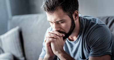 Serious cheerless man looking down