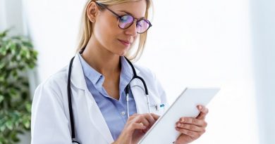 Shot of female doctor using her digital tablet in the consultation.