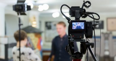 Video of the interview. Television equipment, camcorder with LCD screen, lighting equipment.