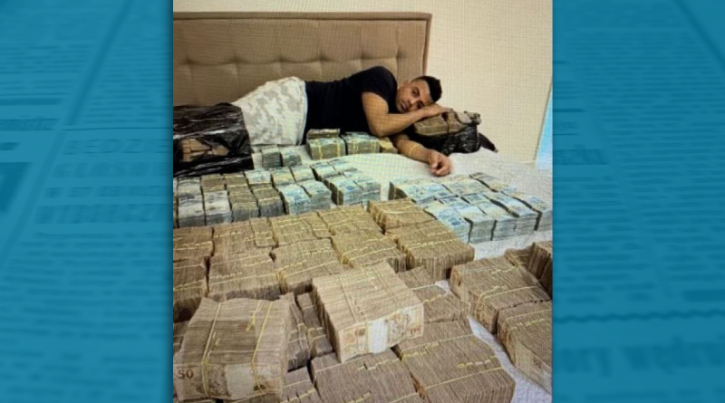 TH Joias deitado numa cama com maços de reais PF suspeita que seja R$ 5 milhões Foto Reprodução